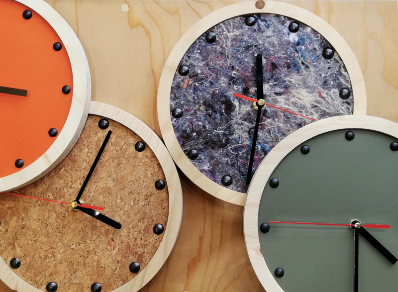 group shot of wooden wall clocks