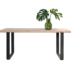 chunky pine wood table with plant